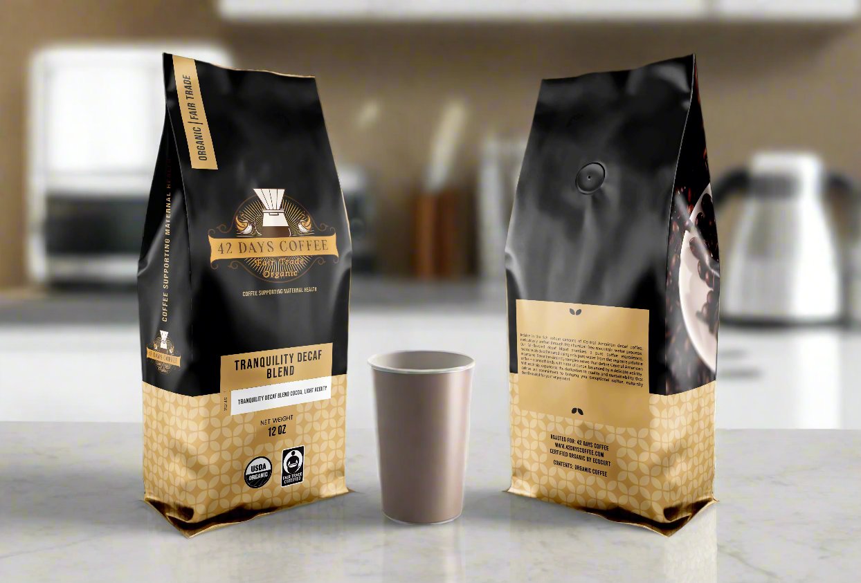 Tranquility Blend Decaf coffee bags. Front and back view sitting on a counter
